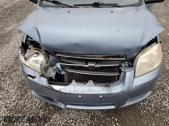 2007 Chevrolet Aveo LS z VIN KL1TD56607B126715, wystawiony jako Copart lot #85206134 z przebiegiem 85 420 mil mil oraz Szkody całkowita. Historia ofert i sprzedaży dostępna na DreamBid. Obrazek 12.