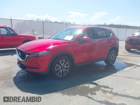 2018 Mazda CX-5 Grand Touring with VIN JM3KFBDM6J0424663, listed as a IAAI auction lot 42003207 with 95,442 mi miles and . Bid and sale history available at DreamBid. Image 17.