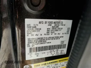 2014 Ford Expedition King Ranch z VIN 1FMJU1J50EEF14834, wystawiony jako Copart lot #56330715 z przebiegiem 159 420 mil mil oraz Szkoda całkowita • Salvage title. Historia ofert i sprzedaży dostępna na DreamBid. Obrazek 13.