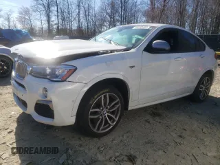 2018 BMW X4 M40i with VIN 5UXXW7C51J0W64529, listed as a Copart auction lot 44030463 with 76,768 mi miles. Bid and sale history available at carsss.com. Image 1.