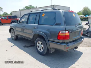 1999 Toyota Land Cruiser z VIN JT3HT05JXX0060572, wystawiony jako IAAI lot #42489190 z przebiegiem 253 014 mil mil oraz . Historia ofert i sprzedaży dostępna na DreamBid. Obrazek 3.