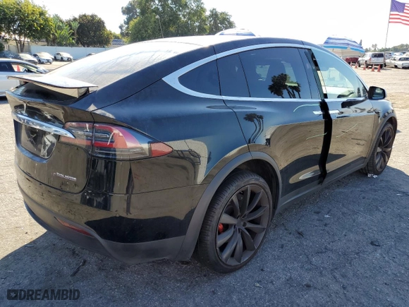 2019 Tesla Model X P100D with VIN 5YJXCBE46KF185298, listed as a Copart auction lot 74799084 with NaN miles and Salvage Title. Bid and sale history available at carsss.com. Image 3.