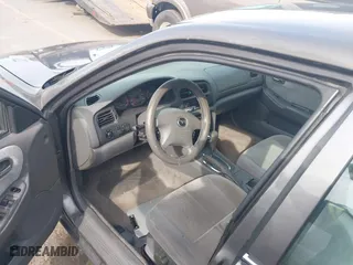 2001 Mazda 626 LX with VIN 1YVGF22C815218444, listed as a IAAI auction lot 41940404 with 143,080 mi miles. Bid and sale history available at carsss.com. Image 5.