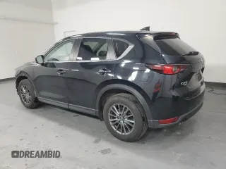 2021 Mazda CX-5 Touring with VIN JM3KFBCMXM0338844, listed as a Copart auction lot 53201615 with 137,498 mi miles and Clean Title. Bid and sale history available at carsss.com. Image 2.
