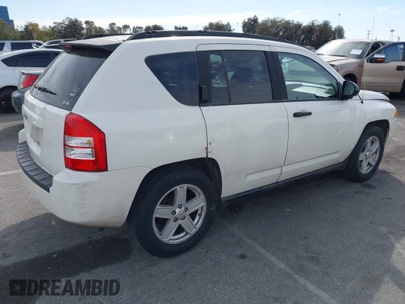 2007 Jeep Compass Sport with VIN 1J8FT47W77D145745, listed as a IAAI auction lot 41687495 with 218,231 mi miles. Bid and sale history available at carsss.com. Image 4.