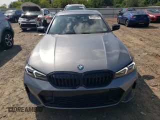 2023 BMW 3 Series 330e xDrive with VIN 3MW39FS02P8D01319, listed as a Copart auction lot 67836734 with 12,883 mi miles and Salvage Title. Bid and sale history available at carsss.com. Image 5.
