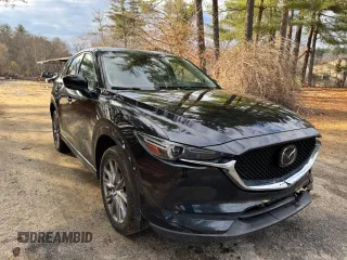 2020 Mazda CX-5 Grand Touring with VIN JM3KFADM8L0785373, listed as a Copart auction lot 50829175 with 135,736 mi miles and Clean Title. Bid and sale history available at DreamBid. Image 1.