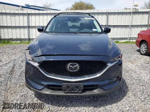 2021 Mazda CX-5 Touring with VIN JM3KFBCM0M0302015, listed as a Copart auction lot 55077305 with 40,558 mi miles and Salvage Title. Bid and sale history available at carsss.com. Image 5.