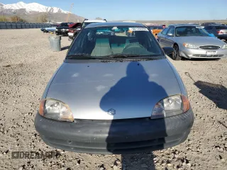 2001 Suzuki Swift GA z VIN 2S2AB21H516602339, wystawiony jako Copart lot #50135584 z przebiegiem 142 476 mil mil oraz Szkody całkowita. Historia ofert i sprzedaży dostępna na DreamBid. Obrazek 5.