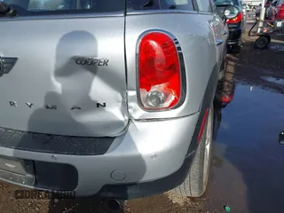 2015 MINI Countryman with VIN WMWZB3C56FWR46360, listed as a IAAI auction lot 41691359 with 88,305 mi miles and . Bid and sale history available at DreamBid. Image 6.