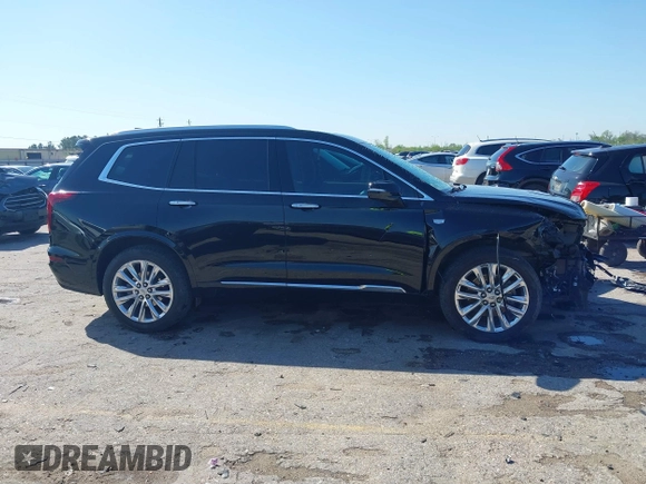 2020 Cadillac XT6 FWD Premium Luxury z VIN 1GYKPERS0LZ232338, wystawiony jako IAAI lot #41845562 z przebiegiem 86 839 mil mil oraz . Historia ofert i sprzedaży dostępna na DreamBid. Obrazek 13.