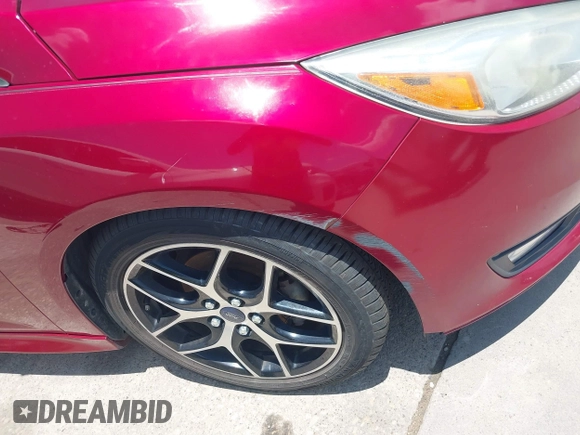 2016 Ford Focus SE z VIN 1FADP3F28GL237888, wystawiony jako IAAI lot #42564140 z przebiegiem 143 210 mil mil oraz . Historia ofert i sprzedaży dostępna na DreamBid. Obrazek 13.