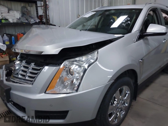 2014 Cadillac SRX Luxury Collection z VIN 3GYFNEE36ES679505, wystawiony jako IAAI lot #41817608 z przebiegiem 62 351 mil mil oraz . Historia ofert i sprzedaży dostępna na DreamBid. Obrazek 18.
