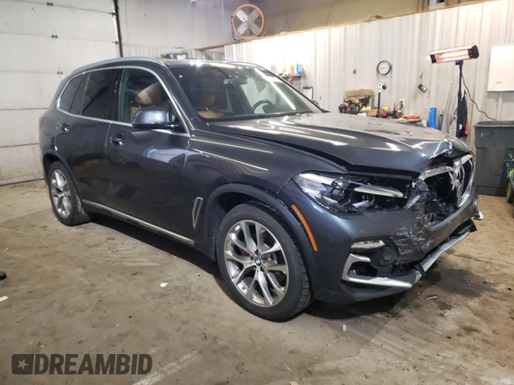 2021 BMW X5 xDrive40i with VIN 5UXCR6C06M9E05140, listed as a Copart auction lot 52402475 with 47,869 mi miles and Salvage title. Bid and sale history available at DreamBid. Image 4.