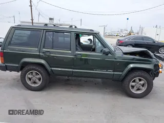 1996 Jeep Cherokee Sport z VIN 1J4FT68S6TL267408, wystawiony jako IAAI lot #42385629 z przebiegiem 268 753 mil mil oraz . Historia ofert i sprzedaży dostępna na DreamBid. Obrazek 13.