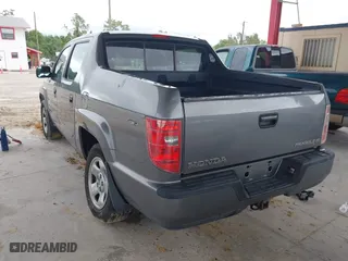 2009 Honda Ridgeline RT with VIN 2HJYK16279H501015, listed as a IAAI auction lot 41996301 with 124,716 mi miles. Bid and sale history available at carsss.com. Image 3.