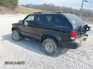 2000 Chevrolet Blazer LS z VIN 1GNCT18W1YK112722, wystawiony jako IAAI lot #41758275 z przebiegiem 157 730 mil mil oraz . Historia ofert i sprzedaży dostępna na DreamBid. Obrazek 3.