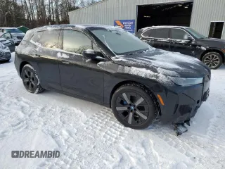2025 BMW iX xDrive50 with VIN WB523CF04SCT20220, listed as a Copart auction lot 83225094 with 0 mi miles and Salvage Title. Bid and sale history available at carsss.com. Image 4.