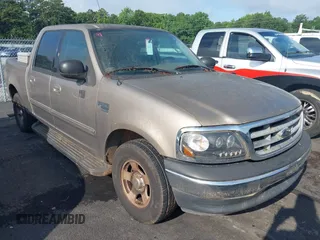2003 Ford F-150 XLT with VIN 1FTRW07L43KA58773, listed as a IAAI auction lot 42379829 with Not provided miles and . Bid and sale history available at DreamBid. Image 1.
