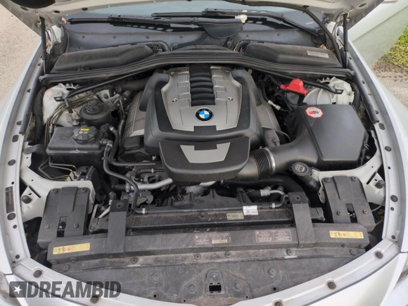 2006 BMW 6 Series 650Ci z VIN WBAEK13406CN72159, wystawiony jako Copart lot #75078214 z przebiegiem Nie podano mil oraz Szkoda całkowita • Salvage title. Historia ofert i sprzedaży dostępna na DreamBid. Obrazek 11.