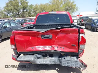 2018 Toyota Tacoma SR5 with VIN 5TFAZ5CN0JX063350, listed as a IAAI auction lot 41829396 with 61,155 mi miles and . Bid and sale history available at DreamBid. Image 17.