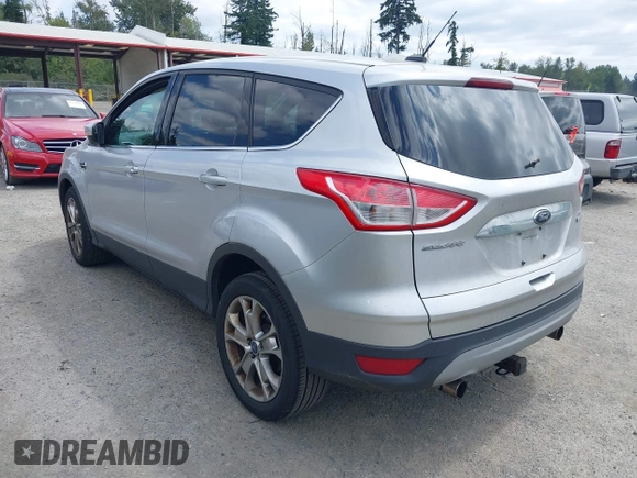 2013 Ford Escape SEL with VIN 1FMCU0HX5DUB53695, listed as a IAAI auction lot 42795881 with 165,330 mi miles and . Bid and sale history available at DreamBid. Image 3.
