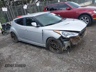 2013 Hyundai Veloster Turbo w/Black Int with VIN KMHTC6AE5DU174898, listed as a IAAI auction lot 41928271 with 119,968 mi miles. Bid and sale history available at carsss.com. Image 1.