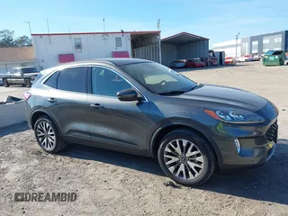 2020 Ford Escape Titanium with VIN 1FMCU9J9XLUA66440, listed as a IAAI auction lot 41464049 with 57,626 mi miles and . Bid and sale history available at DreamBid. Image 13.