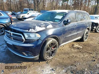 2014 Dodge Durango SXT with VIN 1C4RDHAG5EC369951, listed as a IAAI auction lot 41278358 with 214,453 mi miles and . Bid and sale history available at carsss.com. Image 2.
