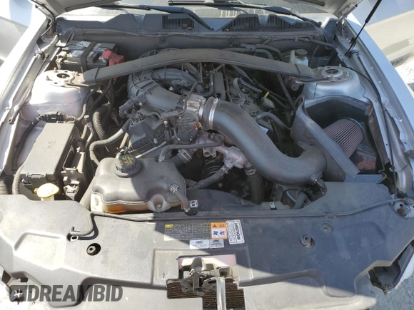 2012 Ford Mustang Premium z VIN 1ZVBP8AM7C5237576, wystawiony jako Copart lot #60374995 z przebiegiem 123 061 mil mil oraz Szkoda całkowita • Salvage title. Historia ofert i sprzedaży dostępna na DreamBid. Obrazek 11.