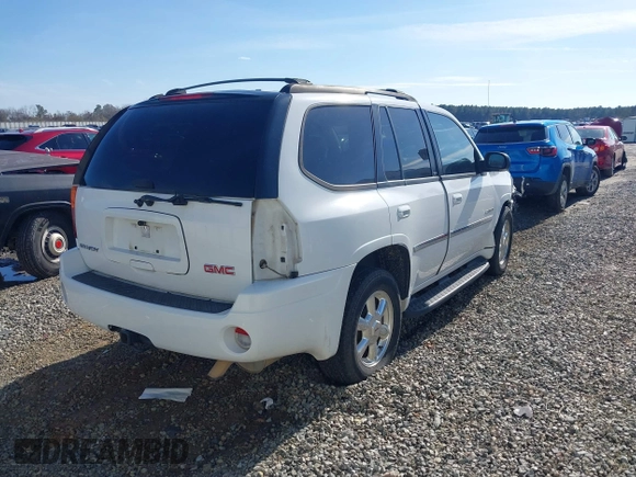 2006 GMC Envoy SLT with VIN 1GKDS13S062128531, listed as a IAAI auction lot 41458983 with 119,385 mi miles. Bid and sale history available at carsss.com. Image 4.