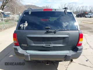 2003 Jeep Grand Cherokee Laredo with VIN 1J4GX48S53C504225, listed as a IAAI auction lot 41879669 with 247,246 mi miles. Bid and sale history available at carsss.com. Image 17.