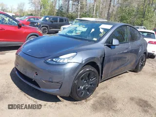 2022 Tesla Model Y Long Range z VIN 7SAYGAEE9NF574634, wystawiony jako IAAI lot #42040719 z przebiegiem 29 675 mil mil oraz . Historia ofert i sprzedaży dostępna na DreamBid. Obrazek 19.