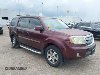 2011 Honda Pilot Touring z VIN 5FNYF4H90BB081811, wystawiony jako IAAI lot #42414676 z przebiegiem 144 173 mil mil oraz . Historia ofert i sprzedaży dostępna na DreamBid. Obrazek 1.