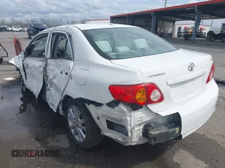 2009 Toyota Corolla with VIN 1NXBU40E59Z023792, listed as a IAAI auction lot 41743473 with 128,454 mi miles. Bid and sale history available at carsss.com. Image 3.