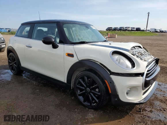 2016 MINI Hardtop with VIN WMWXP5C5XG2D15482, listed as a Copart auction lot 59652125 with 99,066 mi miles and Salvage title. Bid and sale history available at DreamBid. Image 4.