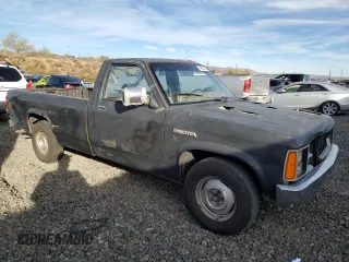 1988 Dodge Dakota z VIN 1B7GN14X5JS776983, wystawiony jako Copart lot #76597944 z przebiegiem 133 654 mil mil oraz Czysty tytuł • Clean title. Historia ofert i sprzedaży dostępna na DreamBid. Obrazek 4.