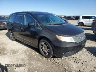 2012 Honda Odyssey EX-L with VIN 5FNRL5H69CB141594, listed as a Copart auction lot 55422115 with 181,745 mi miles and Salvage Title. Bid and sale history available at DreamBid. Image 4.