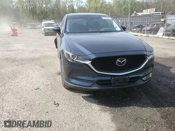 2019 Mazda CX-5 Touring with VIN JM3KFBCM6K0591608, listed as a Copart auction lot 53518385 with 61,618 mi miles and Salvage Title. Bid and sale history available at carsss.com. Image 14.