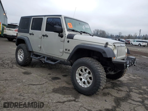 2007 Jeep Wrangler Unlimited X with VIN 1J4GA39177L105582, listed as a Copart auction lot 88912935 with 156,156 mi miles and Salvage Title. Bid and sale history available at DreamBid. Image 4.
