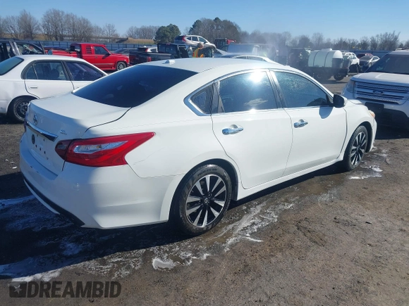 2018 Nissan Altima S with VIN 1N4AL3AP9JC181033, listed as a IAAI auction lot 41400570 with 198,928 mi miles and . Bid and sale history available at carsss.com. Image 4.