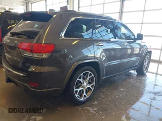 2020 Jeep Grand Cherokee Overland with VIN 1C4RJFCGXLC419668, listed as a IAAI auction lot 41608508 with 104,088 mi miles. Bid and sale history available at carsss.com. Image 4.