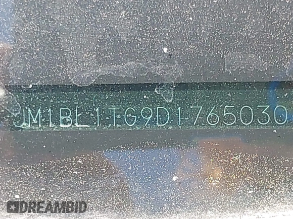 2013 Mazda 3 i SV with VIN JM1BL1TG9D1765030, listed as a IAAI auction lot 42110584 with 143,723 mi miles. Bid and sale history available at carsss.com. Image 9.