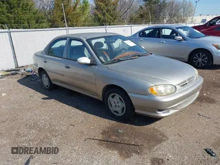 1999 Kia Spectra z VIN KNAFB1215X5767000, wystawiony jako IAAI lot #41764495 z przebiegiem 90 747 mil mil oraz . Historia ofert i sprzedaży dostępna na DreamBid. Obrazek 1.