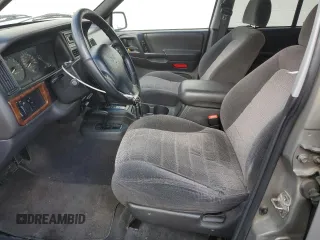 1996 Jeep Grand Cherokee Laredo with VIN 1J4GZ58S3TC245928, listed as a Copart auction lot 57313735 with 165,733 mi miles and Salvage title. Bid and sale history available at DreamBid. Image 7.