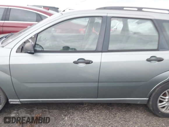 2005 Ford Focus SE with VIN 1FAHP36N65W304897, listed as a IAAI auction lot 40495173 with Not Provided miles and . Bid and sale history available at carsss.com. Image 14.