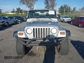 2005 Jeep Wrangler X with VIN 1J4FA39S55P348432, listed as a IAAI auction lot 41868451 with 166,876 mi miles. Bid and sale history available at carsss.com. Image 12.