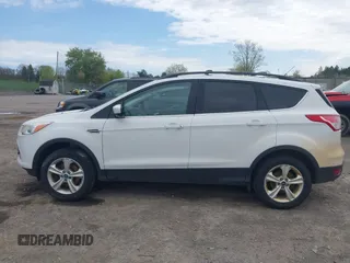 2013 Ford Escape SE with VIN 1FMCU9GX7DUA96986, listed as a IAAI auction lot 42160197 with 193,189 mi miles and . Bid and sale history available at DreamBid. Image 14.