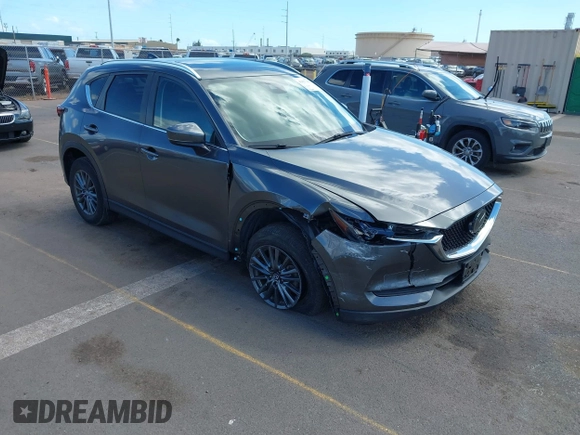 2021 Mazda CX-5 Touring with VIN JM3KFACM2M1348305, listed as a IAAI auction lot 41627199 with 30,044 mi miles. Bid and sale history available at carsss.com. Image 1.