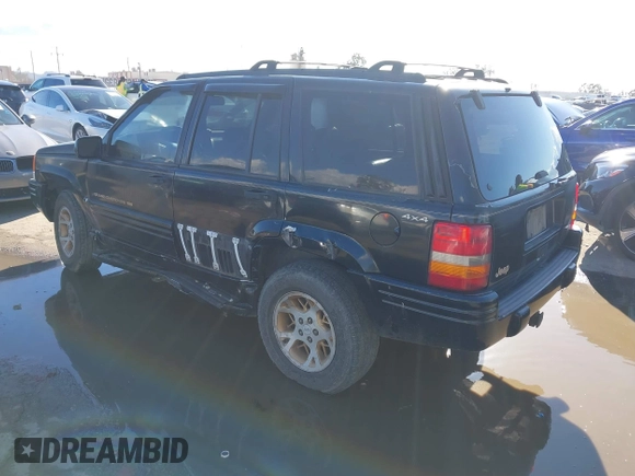 1998 Jeep Grand Cherokee Limited z VIN 1J4GZ78Y3WC105625, wystawiony jako IAAI lot #41742805 z przebiegiem 222 045 mil mil oraz . Historia ofert i sprzedaży dostępna na DreamBid. Obrazek 3.